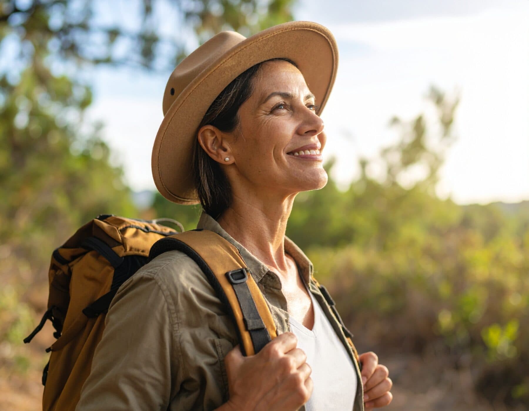 Firefly woman in her forties hiking summer outfit looking away after a long walk 116505